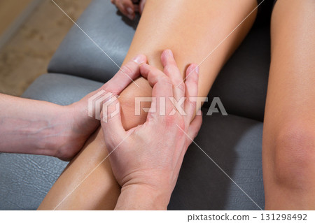 Maitland knee therapy massage on woman leg Maitland knee therapy massage on woman leg 131298492