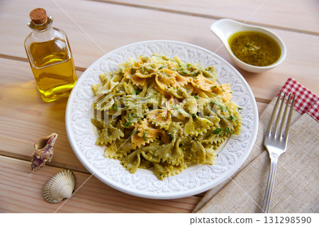 Farfalle pasta with Pesto on wood Farfalle pasta with Pesto on wood 131298590