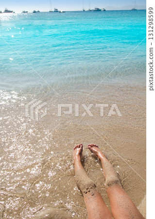 Children girl legs in beach sand shore 131298599