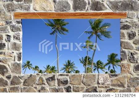 view window tropical palm trees stone masonry wall 131298704
