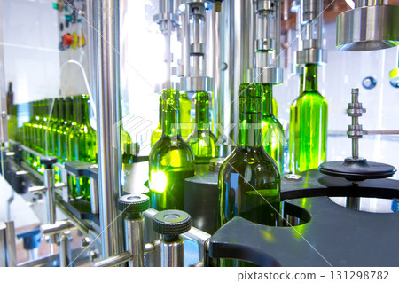 white wine in bottling machine at winery 131298782