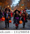 Parents and children decorating Halloween pumpkins 131298858