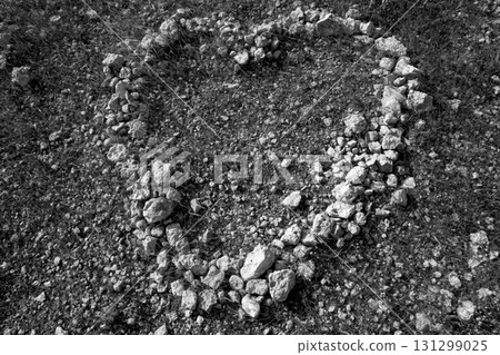 black and white heart shape stones on soil black and white heart shape stones on soil 131299025