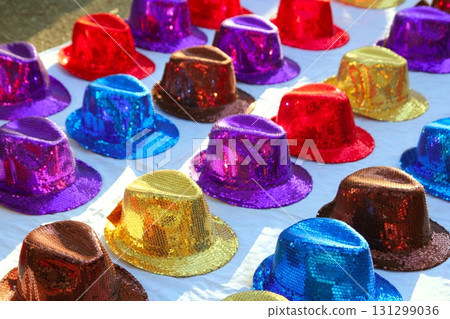 colorful sequins hats in rows in outdoor market 131299036