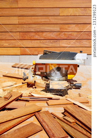 Ipe wood fence installation carpenter table saw 131299123