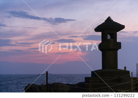 Stone lantern and sunset scenery at Chigogafuchi in Enoshima 131299222