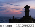 Stone lantern and sunset scenery at Chigogafuchi in Enoshima 131299223