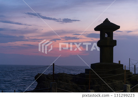 Stone lantern and sunset scenery at Chigogafuchi in Enoshima 131299223