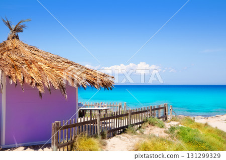 Formentera tropical purple hut on turquoise beach 131299329