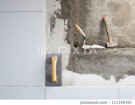 construction tools notched trowel with mortar 131299391
