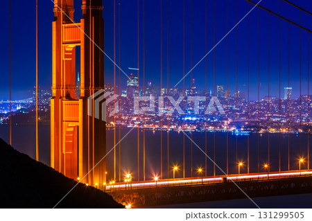 Golden Gate Bridge San Francisco sunset through cables 131299505