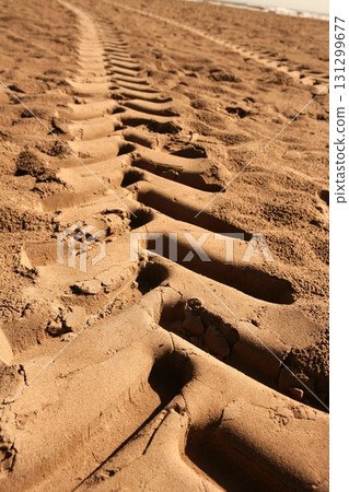 industrial tractor footprint on beach sand industrial tractor footprint on beach sand 131299677