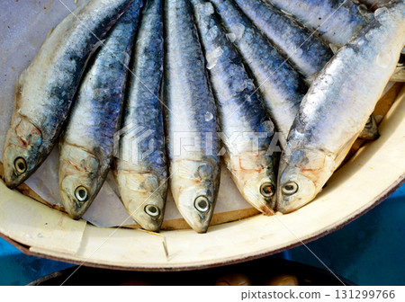 brine salted sardines in round wood box 131299766