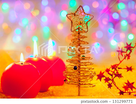 Christmas golden tree baubles and candles Christmas golden tree baubles and candles 131299771