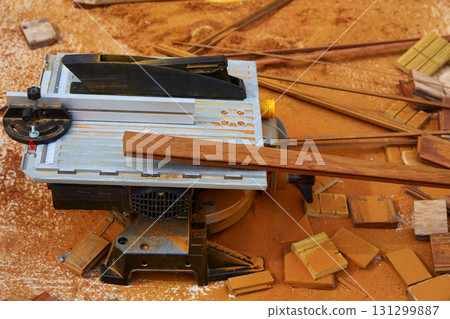 Circular table saw carpenter tool and sawdust 131299887