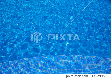 Blue tiles swimming pool water texture Blue tiles swimming pool water texture 131299889