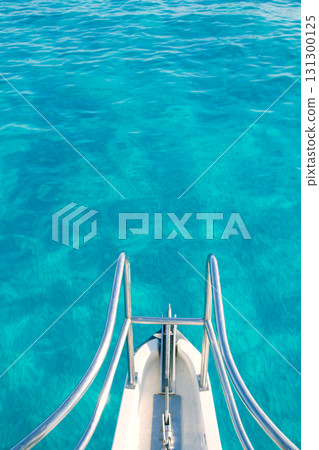 boat bow in transparent turquoise water boat bow in transparent turquoise water 131300125