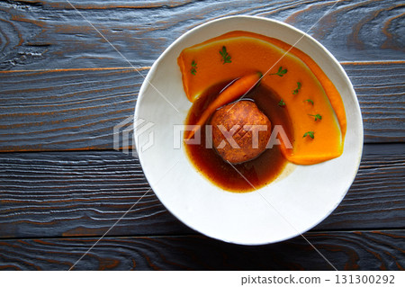 Dumpling of old cowtail with creamy carrot Dumpling of old cowtail with creamy carrot 131300292