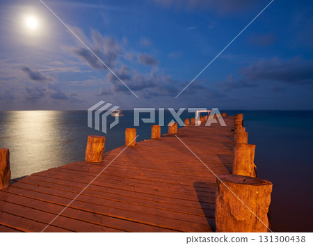 Sunset at Riviera Maya pier in Mexico 131300438
