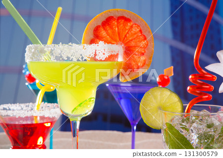 Colorful tropical cocktails in summer at city buildings 131300579