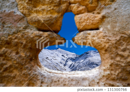 Alhambra window of Sierra Nevada mount Alhambra window of Sierra Nevada mount 131300766