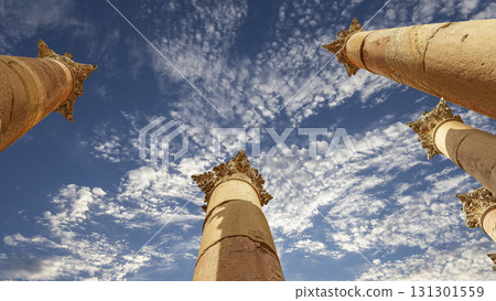 Roman Columns in the Jordanian city of Jerash (Gerasa of Antiquity), capital and largest city of Jerash Governorate, Jordan. Against the background of a beautiful sky with clouds Roman Columns in the Jordanian city of Jerash (Gerasa of Antiquity), capital and largest city of Jerash Governorate, Jordan. Against the background of a beautiful sky with clouds 131301559