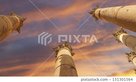 Roman Columns in the Jordanian city of Jerash (Gerasa of Antiquity), capital and largest city of Jerash Governorate, Jordan. Against the background of a beautiful sky with clouds Roman Columns in the Jordanian city of Jerash (Gerasa of Antiquity), capital and largest city of Jerash Governorate, Jordan. Against the background of a beautiful sky with clouds 131301564