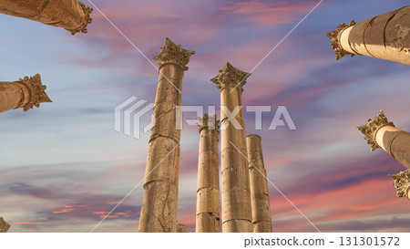 Roman Columns in the Jordanian city of Jerash (Gerasa of Antiquity), capital and largest city of Jerash Governorate, Jordan. Against the background of a beautiful sky with clouds Roman Columns in the Jordanian city of Jerash (Gerasa of Antiquity), capital and largest city of Jerash Governorate, Jordan. Against the background of a beautiful sky with clouds 131301572