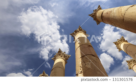 Roman Columns in the Jordanian city of Jerash (Gerasa of Antiquity), capital and largest city of Jerash Governorate, Jordan. Against the background of a beautiful sky with clouds 131301576