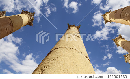 Roman Columns in the Jordanian city of Jerash (Gerasa of Antiquity), capital and largest city of Jerash Governorate, Jordan. Against the background of a beautiful sky with clouds Roman Columns in the Jordanian city of Jerash (Gerasa of Antiquity), capital and largest city of Jerash Governorate, Jordan. Against the background of a beautiful sky with clouds 131301583