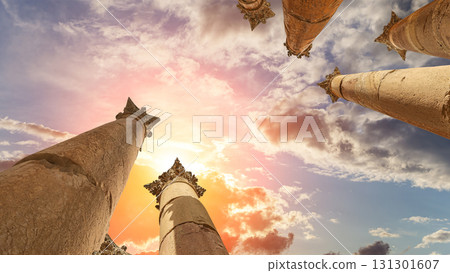 Roman Columns in the Jordanian city of Jerash (Gerasa of Antiquity), capital and largest city of Jerash Governorate, Jordan. Against the background of a beautiful sky with clouds 131301607