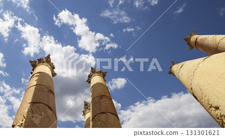 Roman Columns in the Jordanian city of Jerash (Gerasa of Antiquity), capital and largest city of Jerash Governorate, Jordan. Against the background of a beautiful sky with clouds 131301621