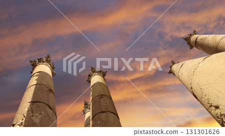 Roman Columns in the Jordanian city of Jerash (Gerasa of Antiquity), capital and largest city of Jerash Governorate, Jordan. Against the background of a beautiful sky with clouds 131301626