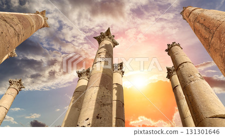 Roman Columns in the Jordanian city of Jerash (Gerasa of Antiquity), capital and largest city of Jerash Governorate, Jordan. Against the background of a beautiful sky with clouds 131301646