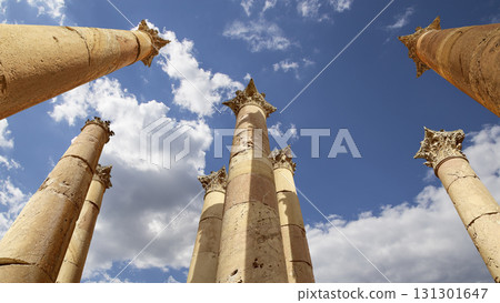Roman Columns in the Jordanian city of Jerash (Gerasa of Antiquity), capital and largest city of Jerash Governorate, Jordan. Against the background of a beautiful sky with clouds Roman Columns in the Jordanian city of Jerash (Gerasa of Antiquity), capital and largest city of Jerash Governorate, Jordan. Against the background of a beautiful sky with clouds 131301647