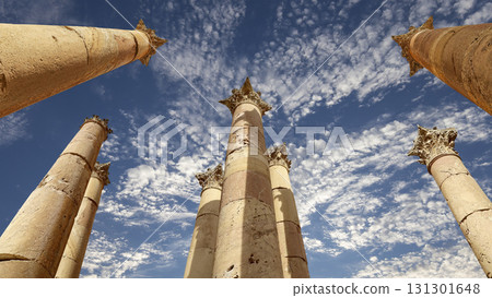 Roman Columns in the Jordanian city of Jerash (Gerasa of Antiquity), capital and largest city of Jerash Governorate, Jordan. Against the background of a beautiful sky with clouds 131301648