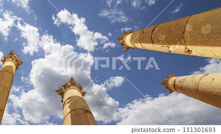 Roman Columns in the Jordanian city of Jerash (Gerasa of Antiquity), capital and largest city of Jerash Governorate, Jordan. Against the background of a beautiful sky with clouds Roman Columns in the Jordanian city of Jerash (Gerasa of Antiquity), capital and largest city of Jerash Governorate, Jordan. Against the background of a beautiful sky with clouds 131301693