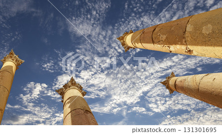 Roman Columns in the Jordanian city of Jerash (Gerasa of Antiquity), capital and largest city of Jerash Governorate, Jordan. Against the background of a beautiful sky with clouds 131301695