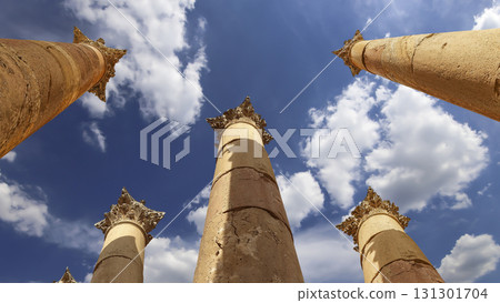 Roman Columns in the Jordanian city of Jerash (Gerasa of Antiquity), capital and largest city of Jerash Governorate, Jordan. Against the background of a beautiful sky with clouds 131301704