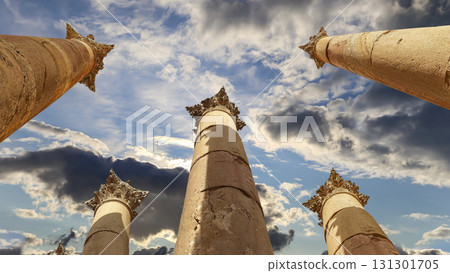 Roman Columns in the Jordanian city of Jerash (Gerasa of Antiquity), capital and largest city of Jerash Governorate, Jordan. Against the background of a beautiful sky with clouds 131301705