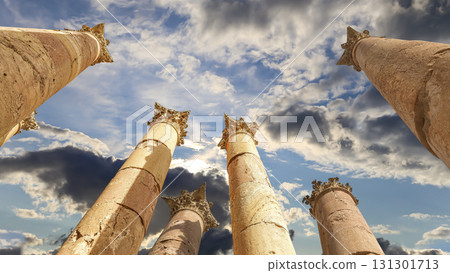 Roman Columns in the Jordanian city of Jerash (Gerasa of Antiquity), capital and largest city of Jerash Governorate, Jordan. Against the background of a beautiful sky with clouds 131301713