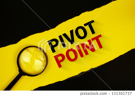 Pivot Point text on yellow with black paper torn ripped and magnifying glass 131301737