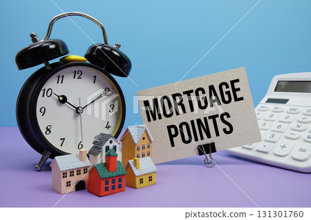 Mortgage Points phrase with Calculator, alarm clock, Model Houses Real Estate Financial Concept Mortgage Points phrase with Calculator, alarm clock, Model Houses Real Estate Financial Concept 131301760