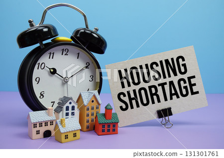 Housing Shortage phrase with Calculator, alarm clock, Model Houses Real Estate Financial Concept Housing Shortage phrase with Calculator, alarm clock, Model Houses Real Estate Financial Concept 131301761