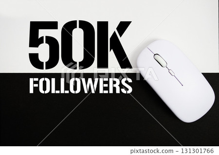 50K Followers and wireless mouse on white and black background 50K Followers and wireless mouse on white and black background 131301766