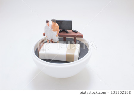 Tiny Couple In Bathrobes Stand By Desk And Bed Inside Tiny Couple In Bathrobes Stand By Desk And Bed Inside 131302198