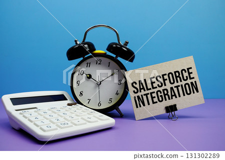 Salesforce Integration text with calculator and alarm clock on blue and purple background 131302289