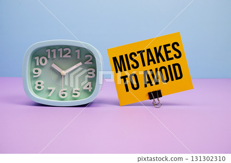 Mistakes To Avoid text and alarm clock on blue and purple background Mistakes To Avoid text and alarm clock on blue and purple background 131302310