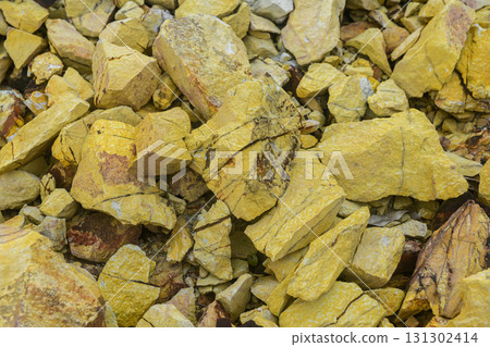 Close-up of sulfur mineral rocks in yellow tones. 131302414