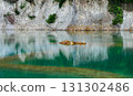 Abandoned quarry pond with green turquoise water. 131302486